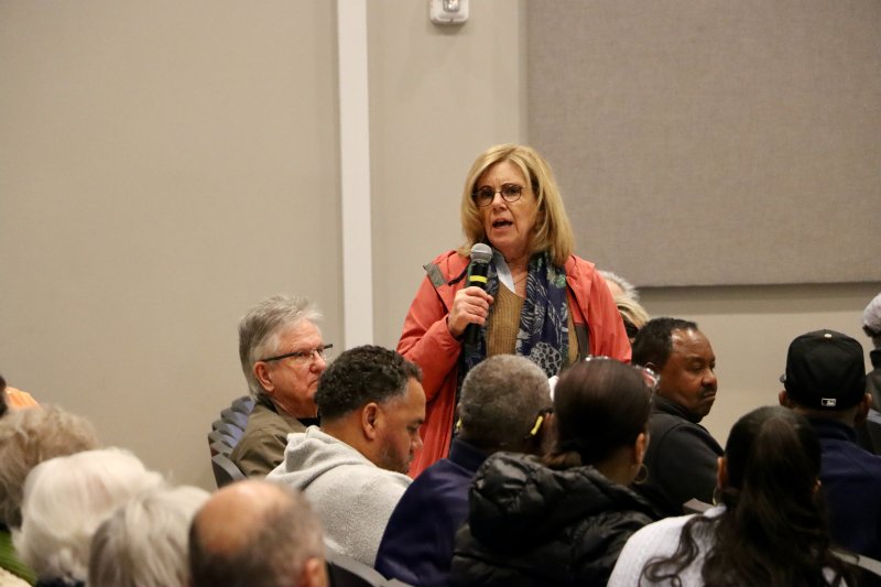 Lewes Mayor Amy Marasco addresses the audience about her plan to create a working group on historical markers in the city, which could include recognition of the playground.