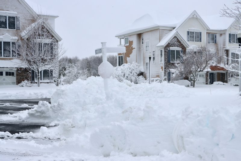 Some streets in the Grande at Canal Pointe were plowed early Monday morning, leaving the first what are sure to be many big snow piles.
BILL SHULL PHOTO