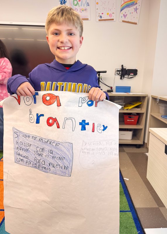 Brantley Sherman holds up his campaign poster for display.