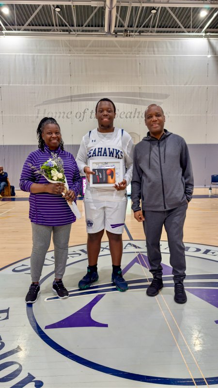 Seahawks senior Dan Marius walked with his mom Marie and dad Darnel.