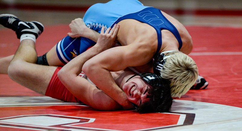 Cape’s Carson Tuer gets a tech fall over Patrick Blisard.