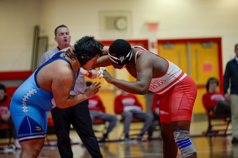 Big guys lock up. Javier Morales of Cape and Takai Fearon of Smyrna battle on the mat.