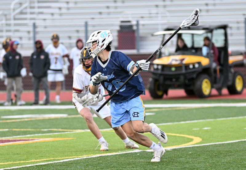 Cape senior Brooks Leonhartt clears the ball from the Milford offensive zone.