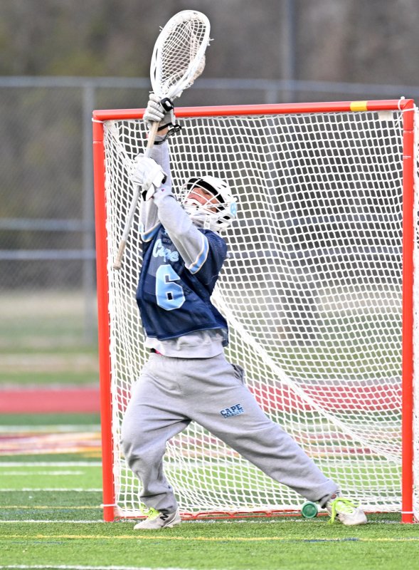 Cape junior goalie Patrick Little makes one of his four saves.