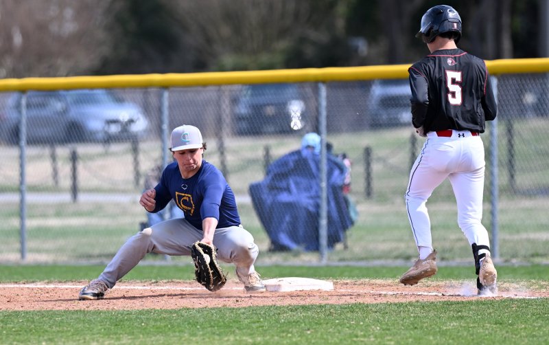 Cape senior first baseman Max Selders scoops up a throw for an out in the scrimmage with Red Lion.