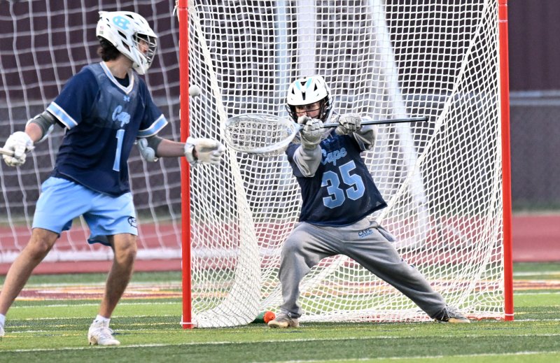 Cape senior goalie Mason Trench makes one of his five saves.