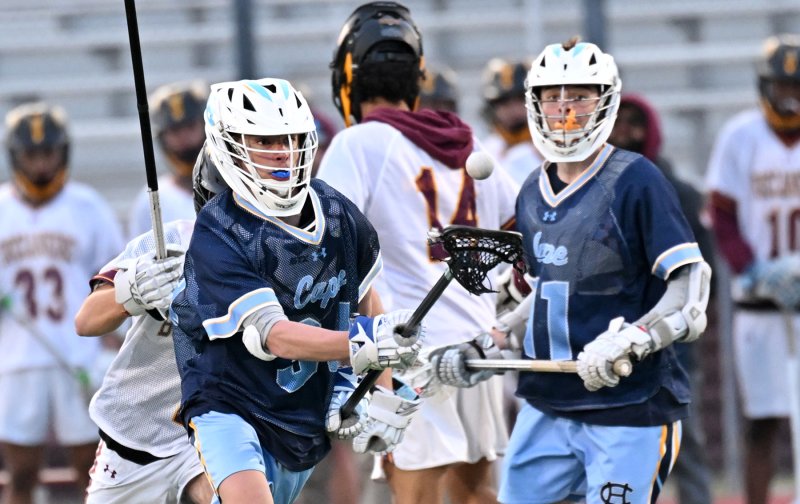 Cape’s Jaxson Holgerson, left, and Braddock Smith battles for a loose ball.