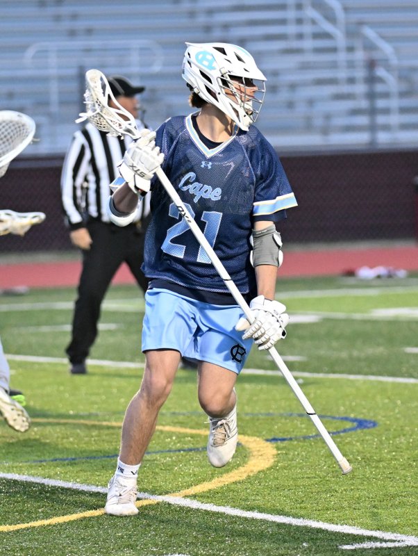 Cape junior defender Drew Mongeluzo looks to get the clear.