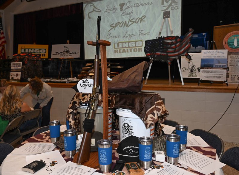 Sponsor tables are decorated with Ducks Unlimited items.