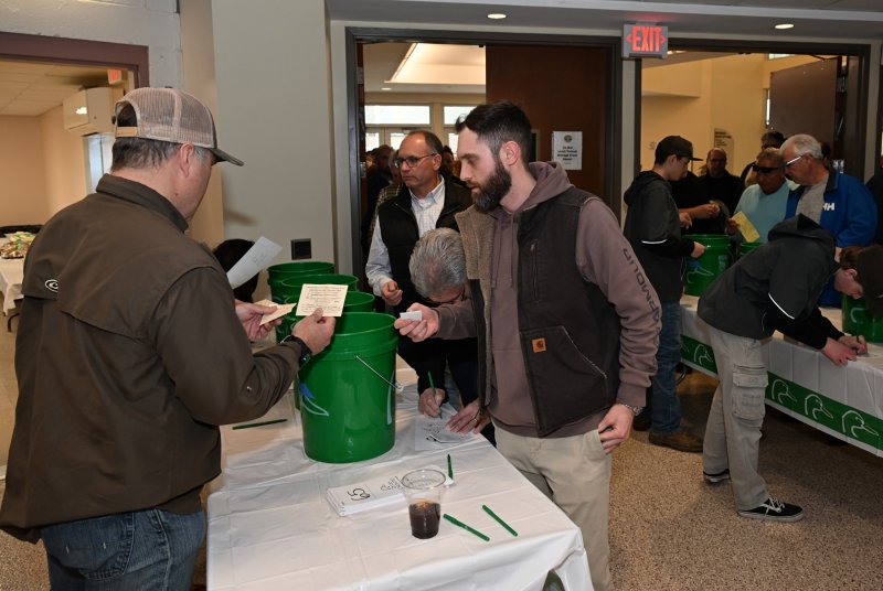 Brandon Ranalli signs in at the event.
