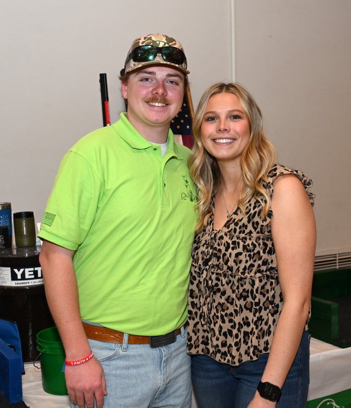 Wyatt Simpler and Jade Conaway work the dice table.