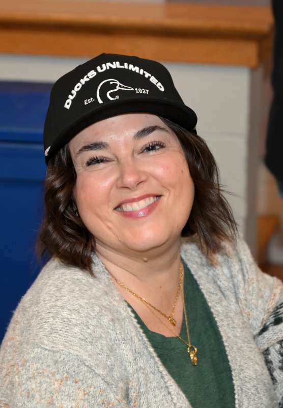 Kerri Wiggins shows of her Ducks Unlimited swag.