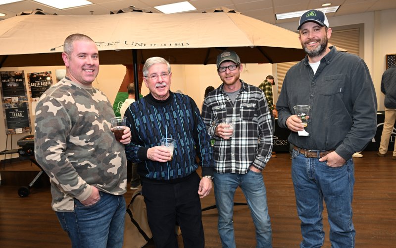 Checking out the silent auction room are (l-r) Brandon Hazzard, Sanford Hazzard, Kenny Terhune and Brandon Bonk.