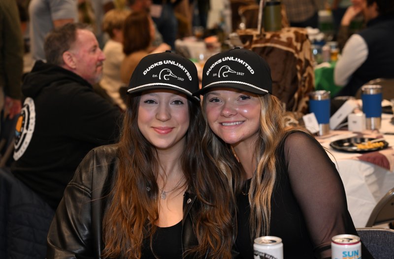 Haylee Turner, left, and Jocelyn Holden show off their Ducks Unlimited swag.