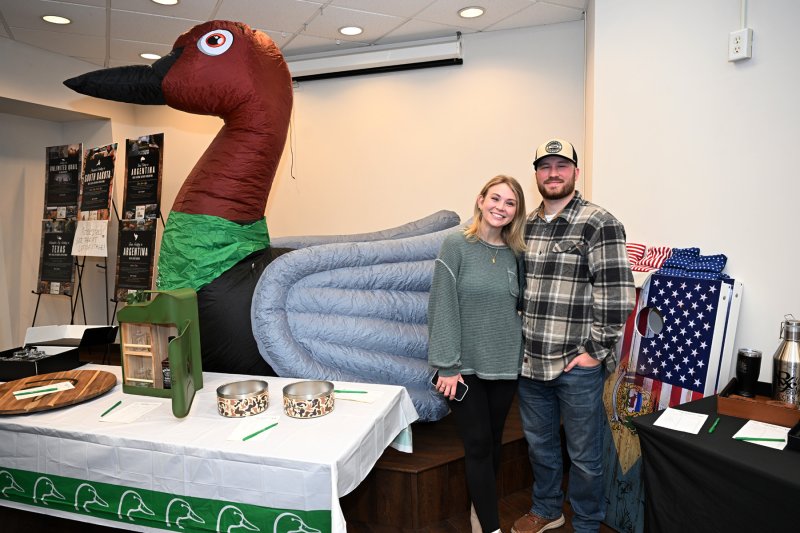 Kristen Greenly, left, and Landon Best check out the silent auction items.
