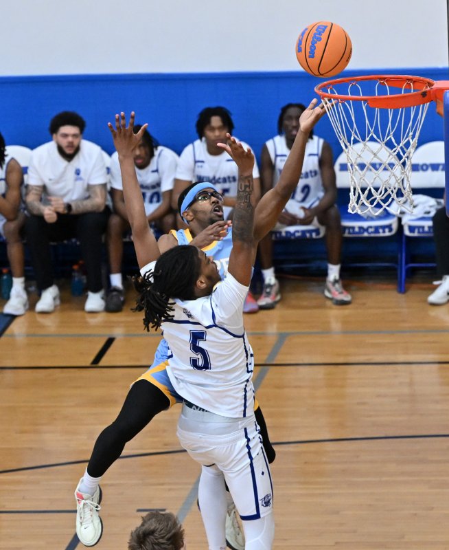 Cape junior Oz Batson lays one in past Howard’s Dominic Awahmukalah.