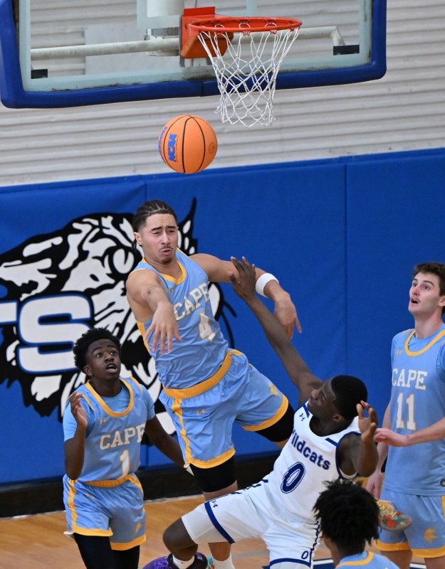 Cape junior Jameson Tingle blocks the shot of Howard’s Nicholas Baysah.