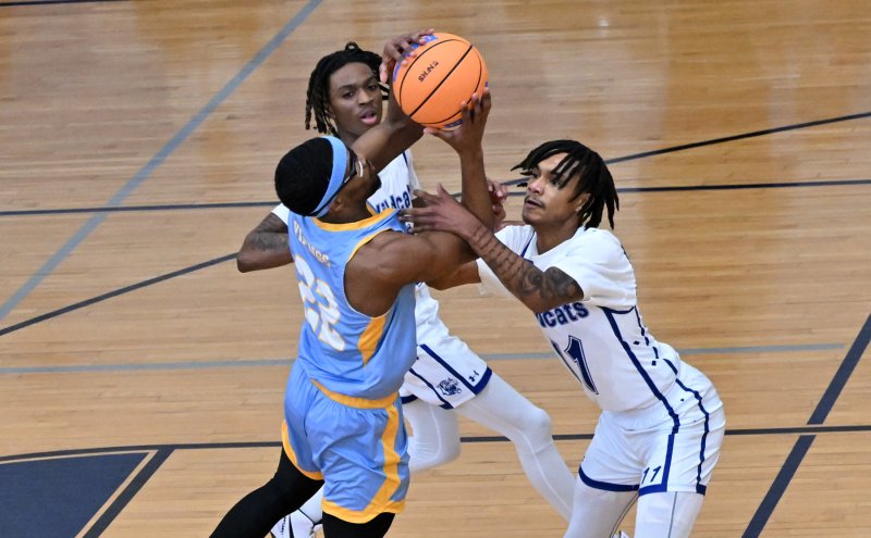 Oz Batson gets fouled by Howard’s Ghazi Abdurrafi.