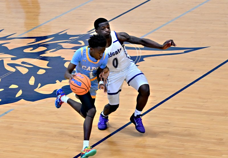 Cape’s Stephen Sivels gets by Howard’s Nicholas Baysah.