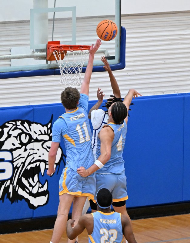 Braxton Figgs and Jameson Tingle block a Howard shot attempt.