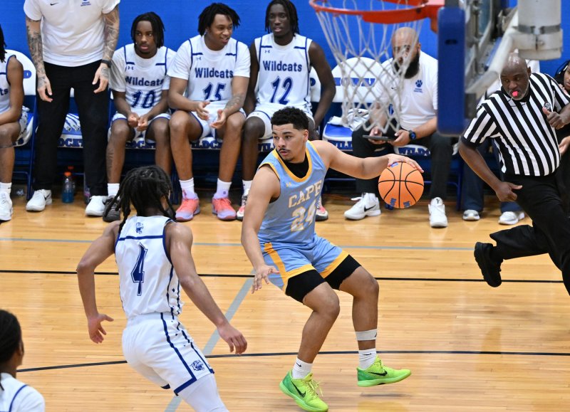 Cape senior Dell Richards looks to go inside on Howard’s Bryson Lane.