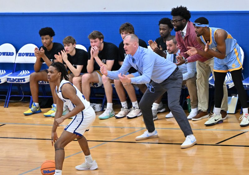 Cape coach Steve Re calls his defense in close.