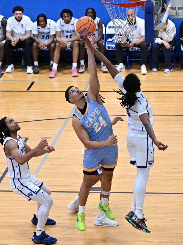 Cape senior Dell Richards gets a rebound over Howard’s Dominic Awahmukalah.