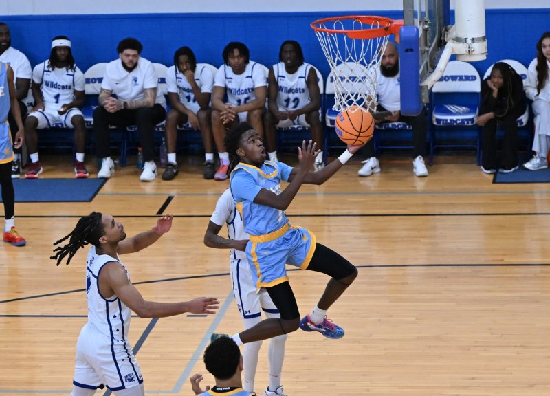 Cape junior gard Stephen Sivelks glides in for a basket for two of his 18 points.