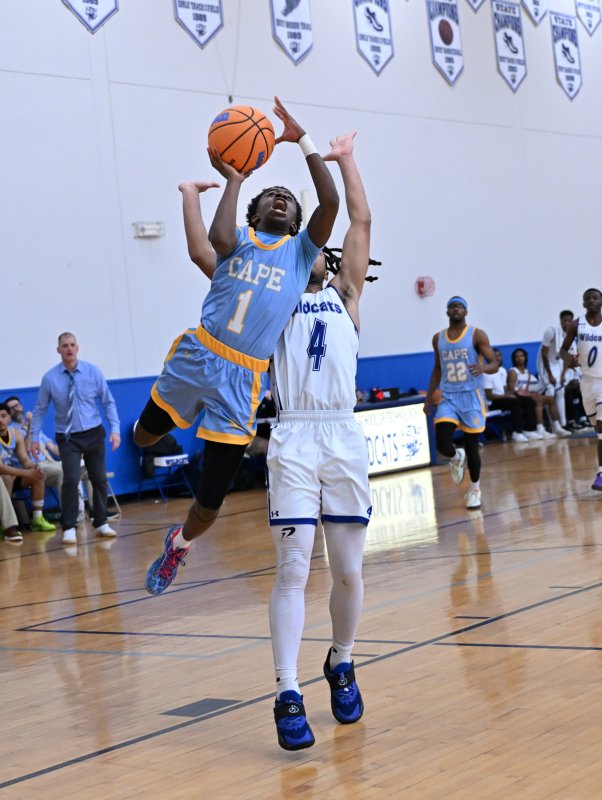 Stephen Sivels goes up past Howard’s Bryson Lane.