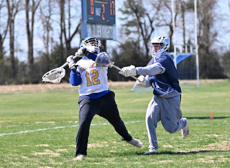 Cape’s David Adili-Khams checks Central keeper Shane McCray.