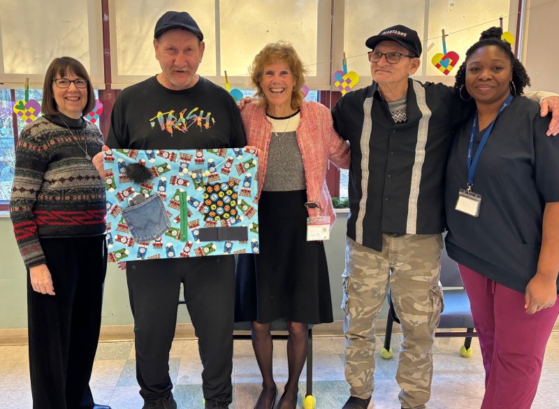 Gathered at Easterseals in Georgetown for the delivery of fidget blankets are (l-r) GFWC Delaware President Jan Conant; Jose Rivero; Linda Forte, community relations and events coordinator; Thomas Hansen; and Ebony Keaton.