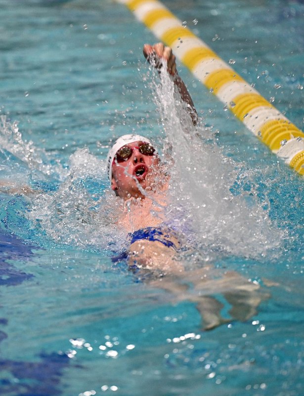Sussex Academy’s Michael Whitaker swims the backstroke leg of the medley relay.