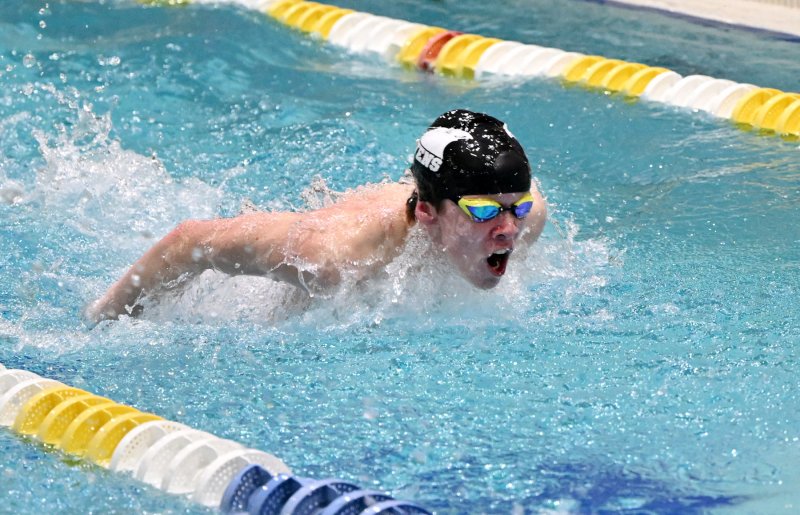 Sussex Tech’s Ethan Schirmer swims the 100 butterfly for the Ravens.