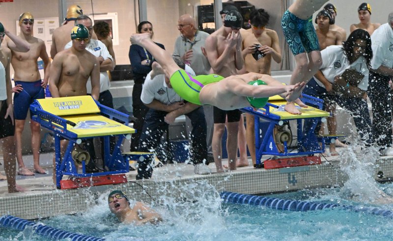 Indian River’s Landon Arauz leaves the blocks after teammate Harrison Benner tags up in the 200 free relay.