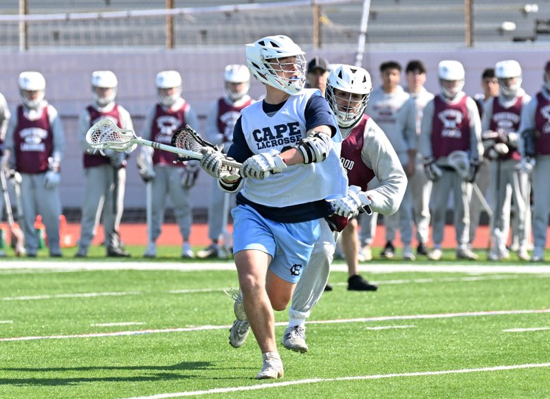 Sophomore Channing Smith goes in for a shot on the Ridgewood goal.