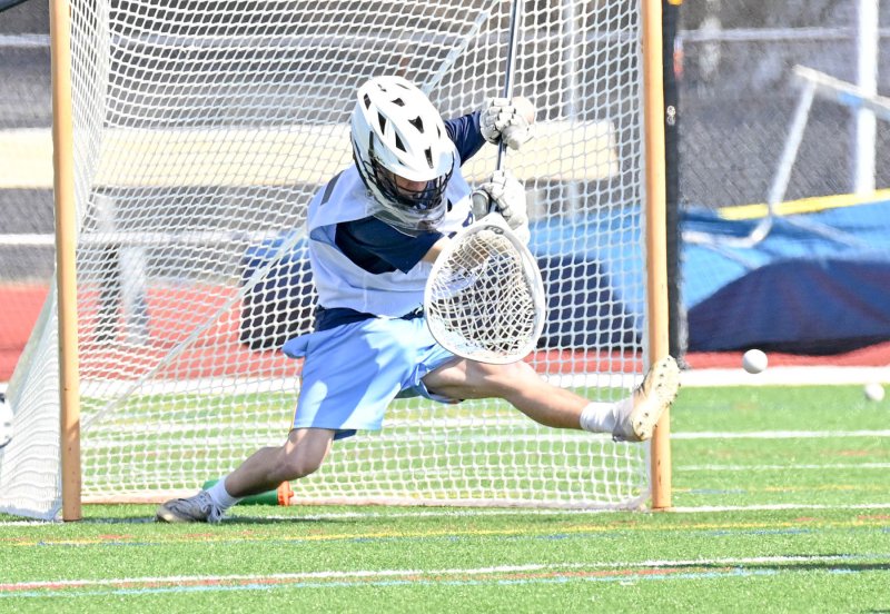 Cape senior goalie Mason Trench makes a kick save against Ridgewood.