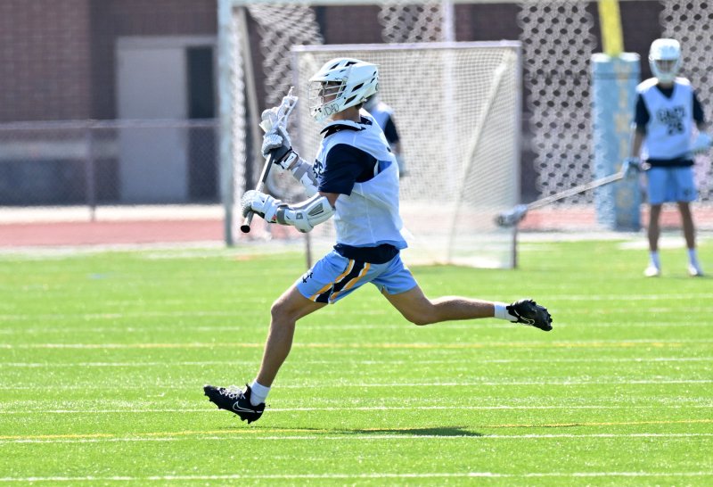 Cape’s Grant Conway flies across the field.