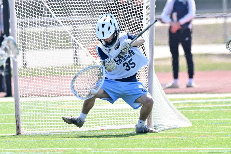 Cape senior Mason Trench makes one of his nine stops in the 6-5 win over Ridgewood.