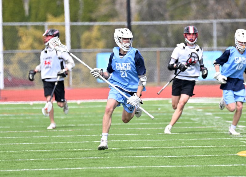 Cape junior long pole Drew Mongeluzo clears the ball from the Pioneers’ offensive zone.