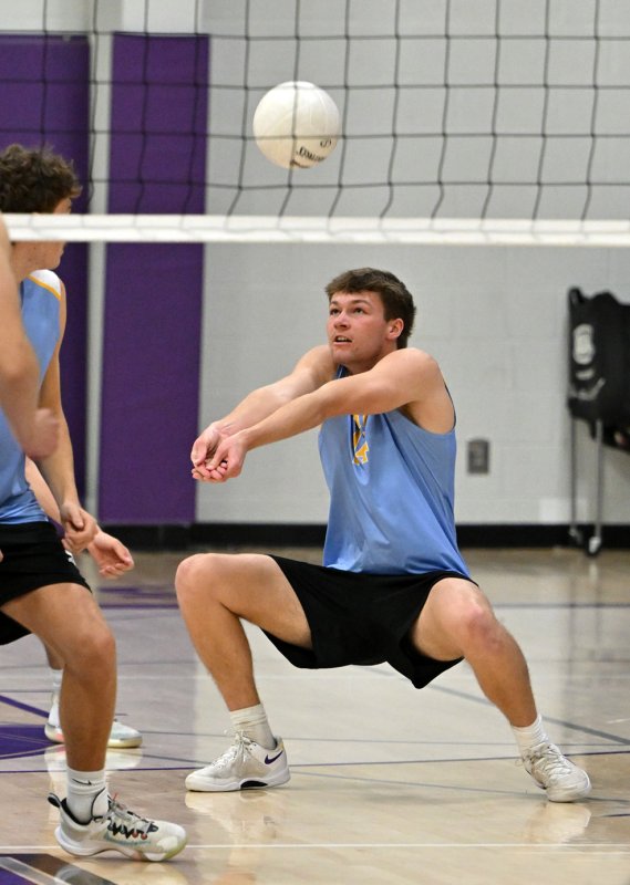 Cape senior Lawson Whaley bumps a service return.