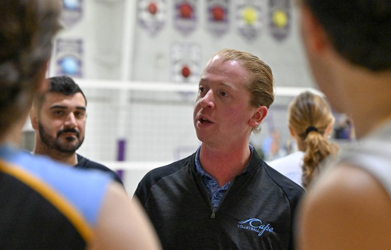 Cape coach Tyler Coupe speaks with his team during a time-out.