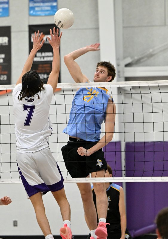 Cape senior Braxton Figgs pounds a kill past Royals senior Seth Mifflin.