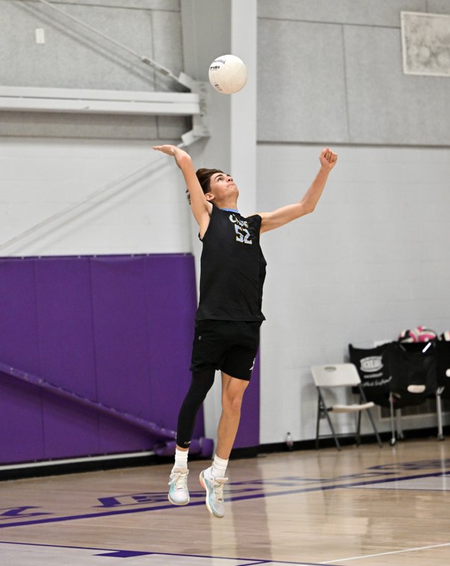 Cape junior libero Jacob Panyko serves one of his two aces in the match.