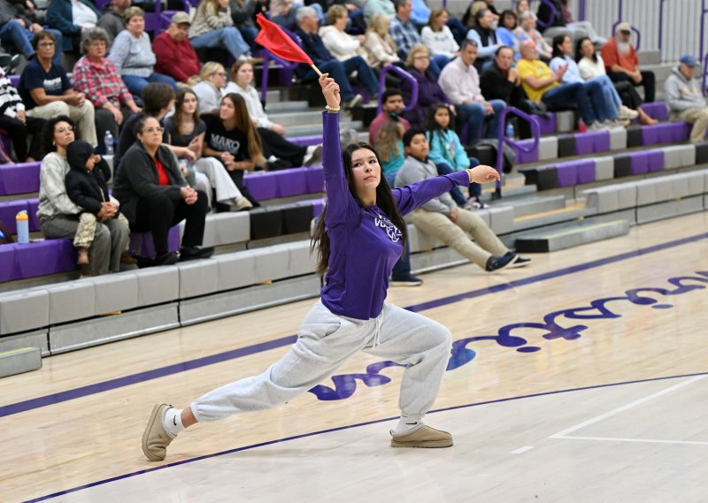 Royals freshman manager Lyla Reese gives a little flair as she makes an out call.