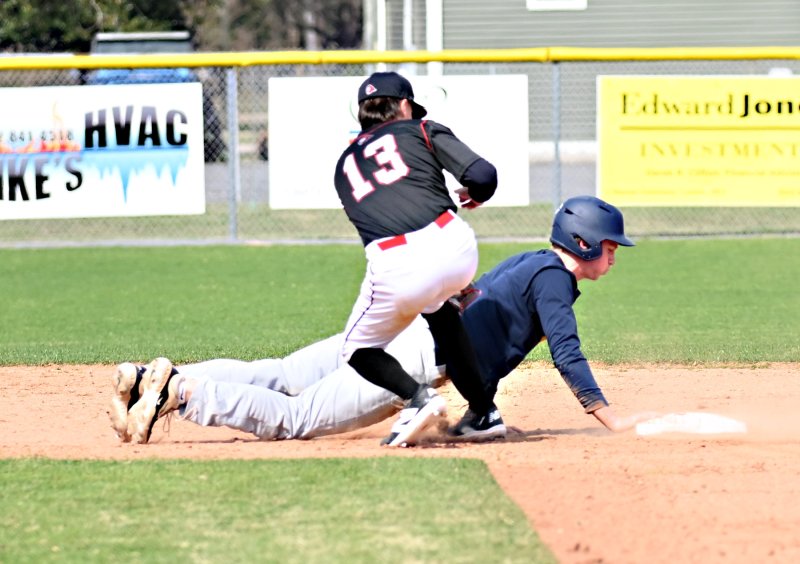 Cape sophomore Joe Ruark dives safely back to second.