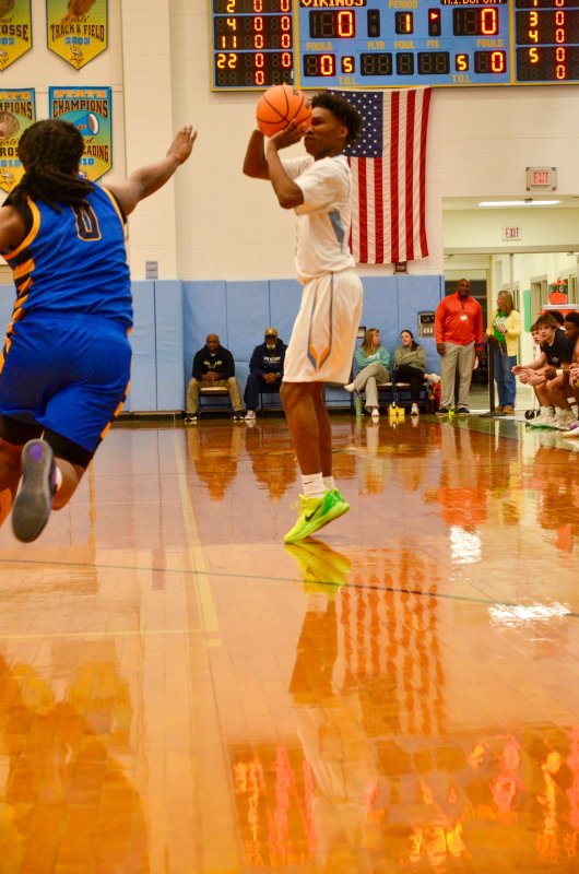 Vikings junior Geordan Downing splashed down a three-pointer to get the crowd into the game early.