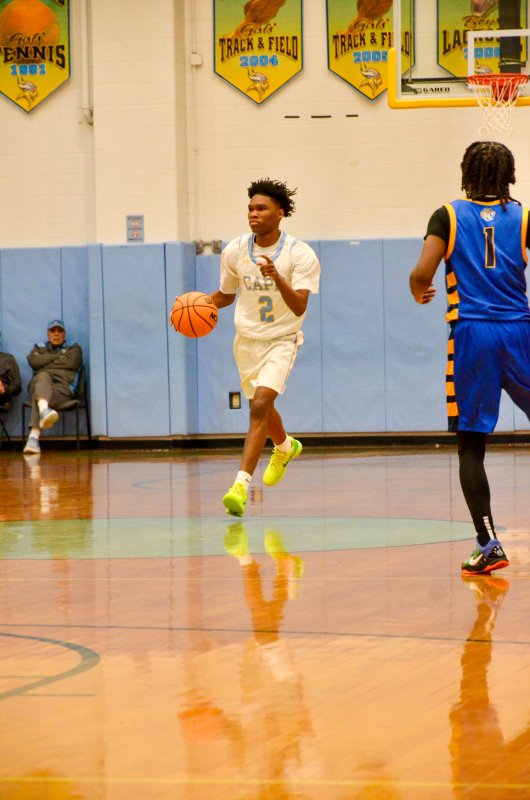 Cape junior Geordan Downing coordinates the offense as he crosses mid-court.