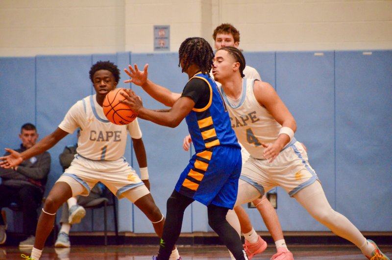 Cape junior Jameson Tingle was aggressive on defense, knowing Steve Sivels, left, and Braxton Figgs were ready to slide.