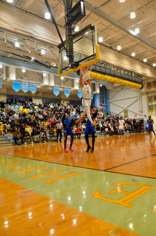 Cape junior Jameson Tingle finishes off the second part of the alley-oop with some serious air.