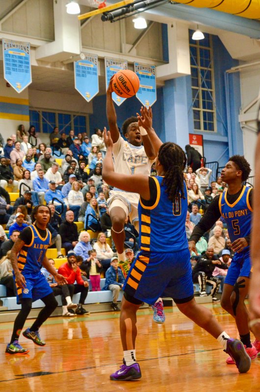 Cape junior Steve Sivels passes as the defense collapses.